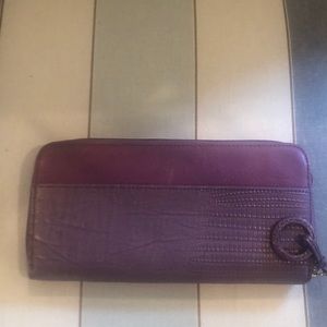 Purple leather clutch